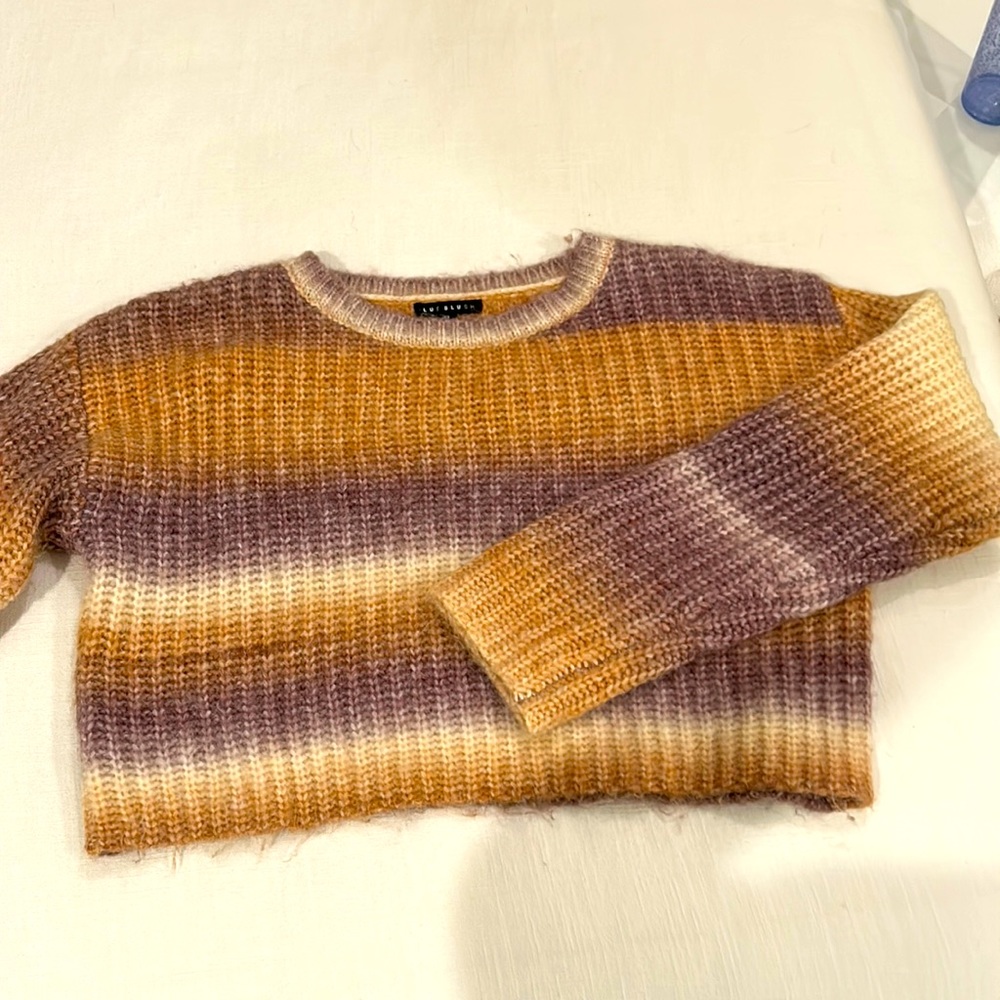 Orange, purple, and white sweater